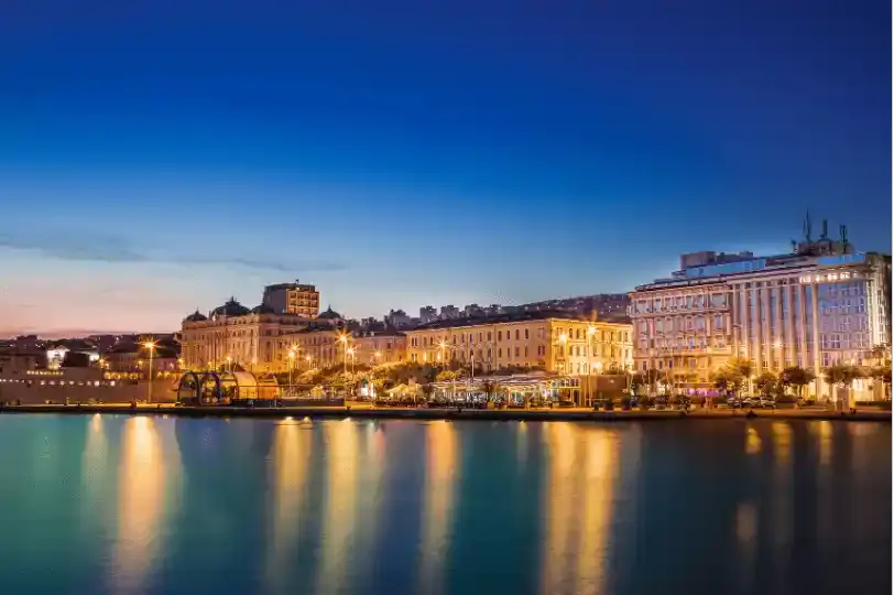 A lit Croatian waterfront at dusk