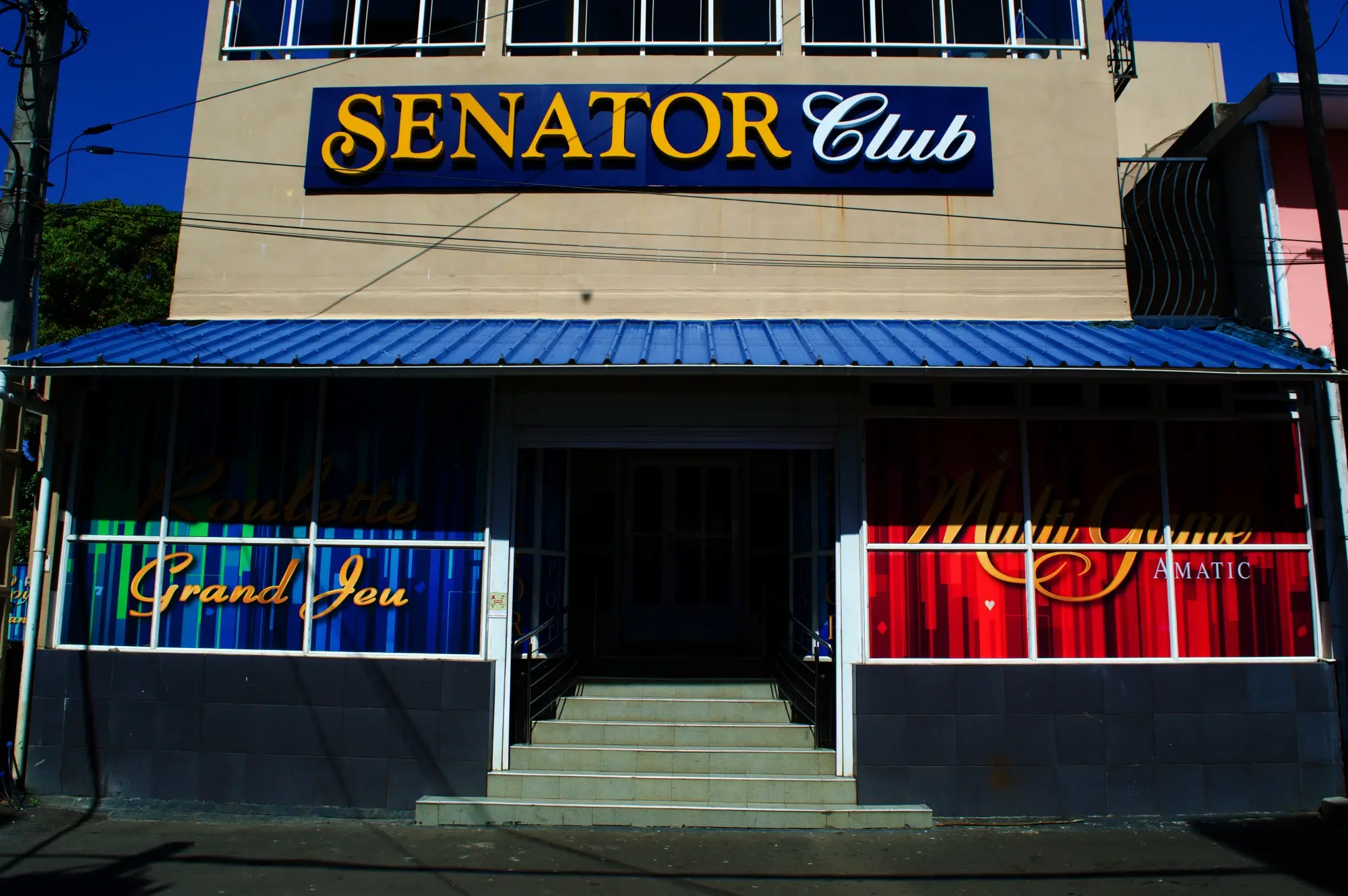 The lit Senator Club sign over the entrance, Grand Baie, Mauritius