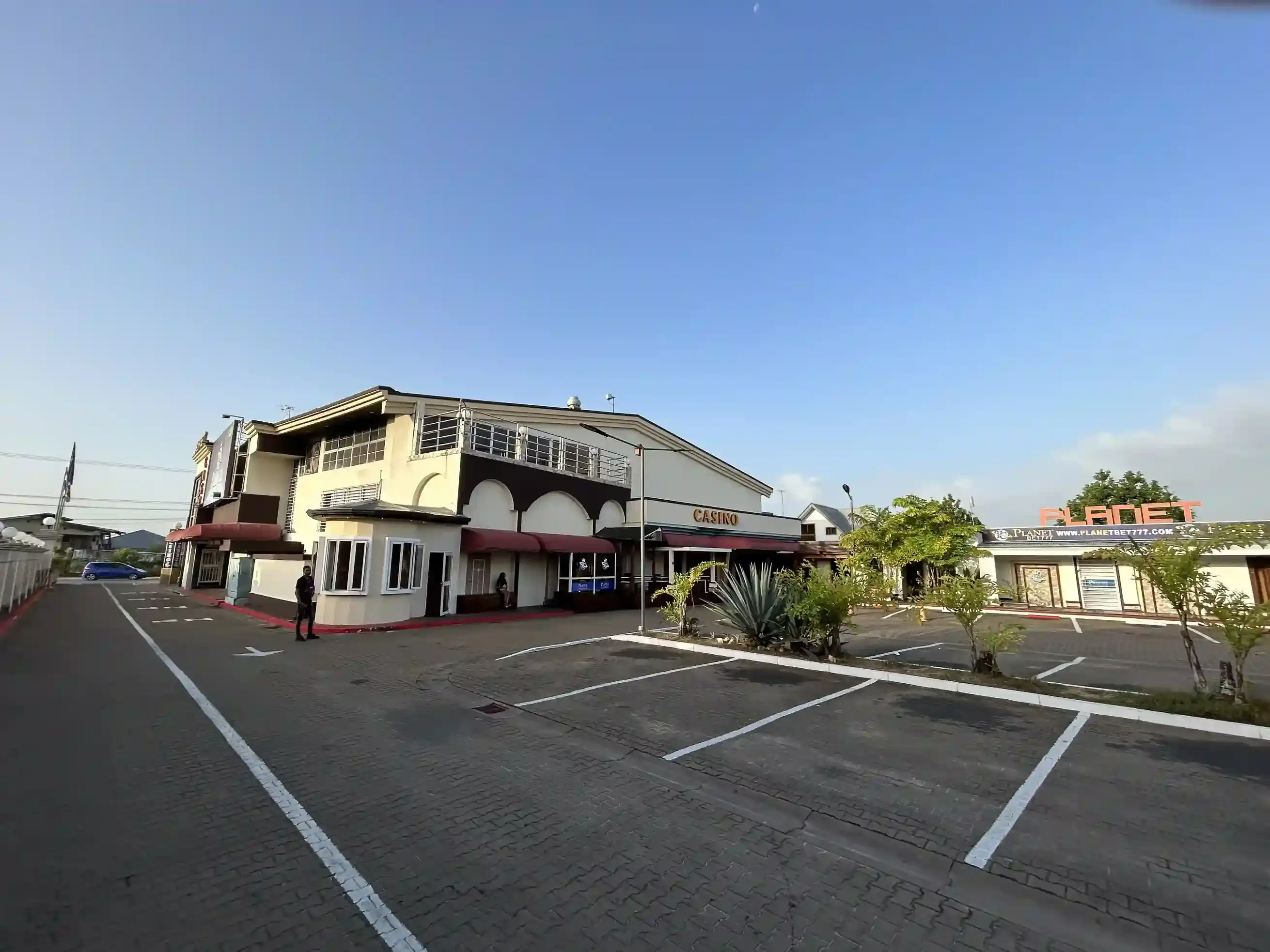 A casino frontage in Paramaribo with the planetbet777.com sign alongside